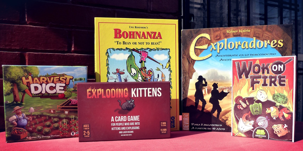 Juegos Harvest Dice, Exploding Kittens, Bohnanza, Exploradores y Wok on Fire